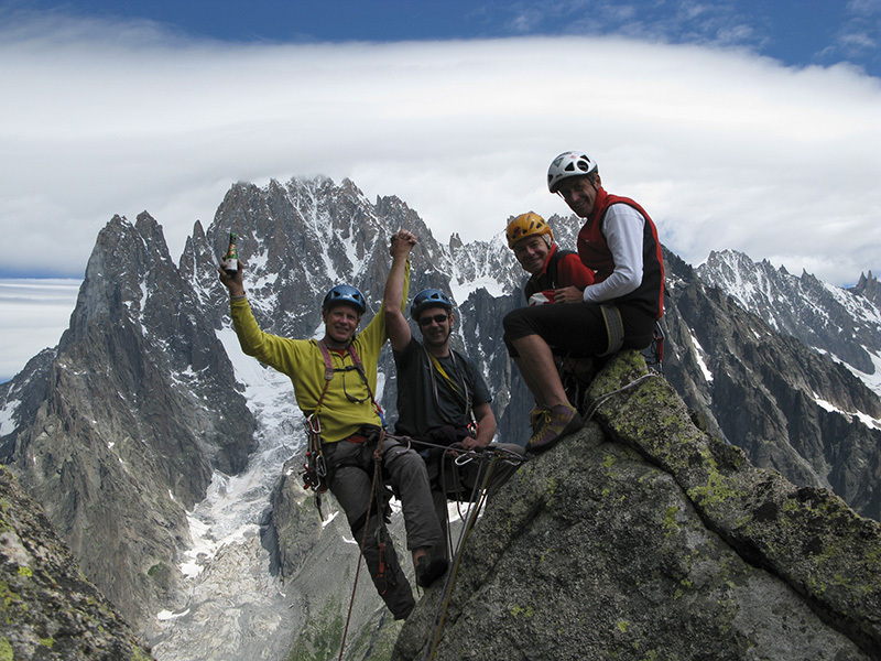 Michel Piola, Gerard Hopfgartner, Pascal Strappazzon and Vincent Sprungli celebrate the 25th anniversary of Marchand de Sable on Tour Rouge, one of the most famous climbs first ascended by Piola. - Photo by Pascal Strappazzon e Vincent Sprüngli